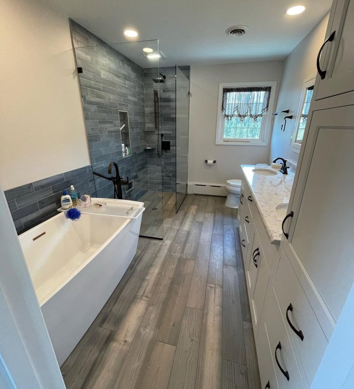 bathroom with tub and shower