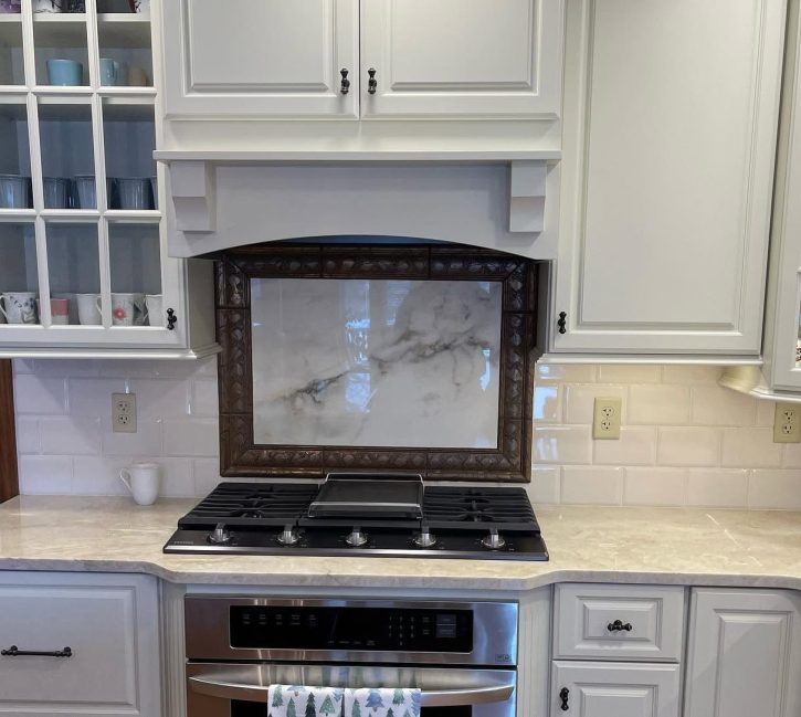 kitchen stove design with fancy framed marble backsplash