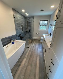 bathroom with tub and shower