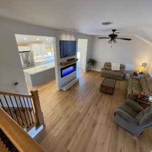 living room wall with electric fireplace and flat screen tv